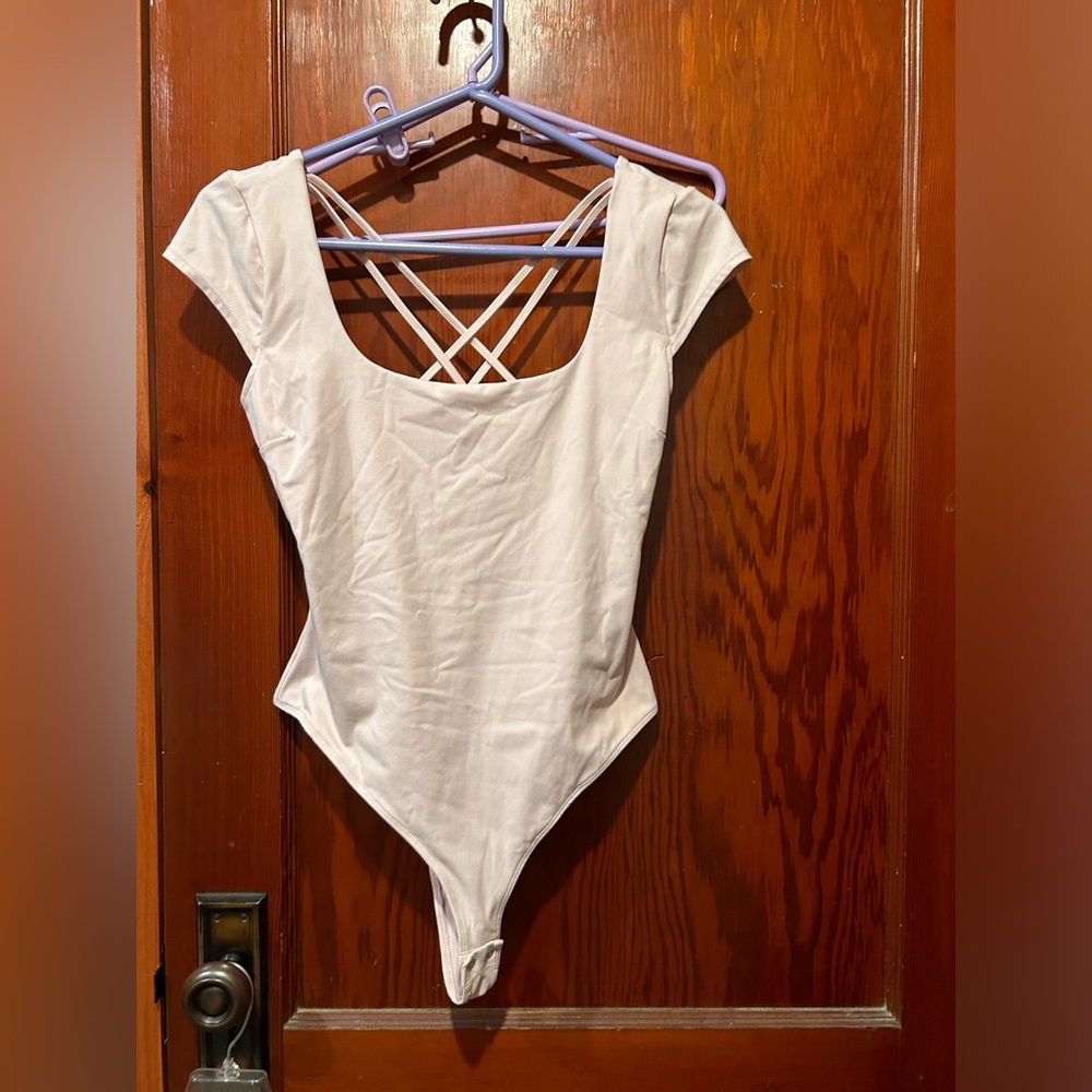 Garage light pink thong bodysuit